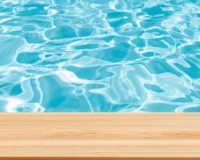 Closeup Clear wooden studio background beside swimming pool - well use for present products.